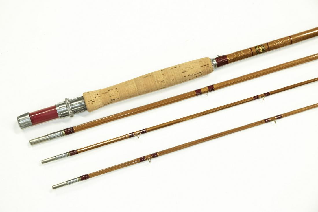 9' MONTAGUE 'REDWING' FLY ROD, 3-SECTION, SPARE TIP, IN: 1932-1939 vintage, in the original red bag with label marked 'Premium Trout'. Made in Massachusetts. Near fine condition, scratches to butt, possibly unused.