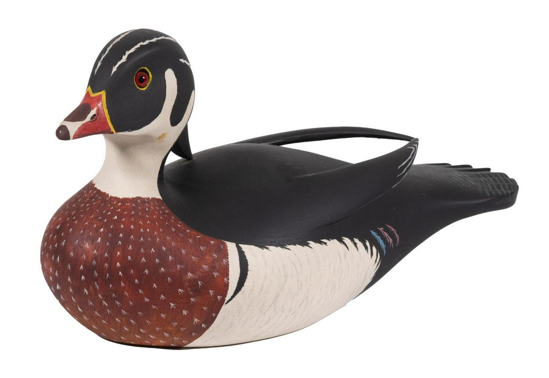 DUCK DECOY BY CAPTAIN GERALD B. SMITH, MARBLEHEAD, MA: Male Wood Duck, in carved and painted wood, branded on base "G.B. Smith Decoys, Marblehead", base impressed "490", 7 3/4" high, 13 1/2" x 5 1/2". Good condition.