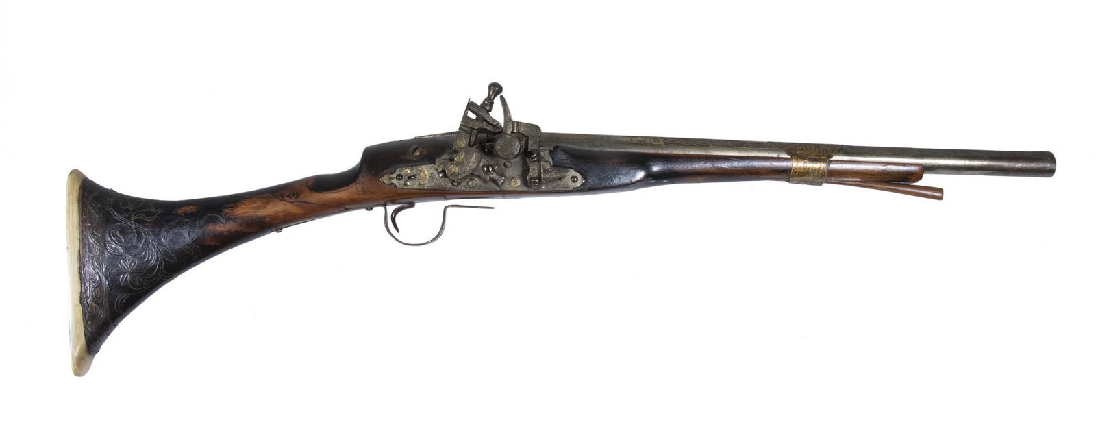 OTTOMAN MIQUELET FLINTLOCK SADDLE GUN, EARLY 19TH C.: Possibly Turkish or Moroccan in origin, with an engraved beveled top round barrel, 55 ga., extensive silver leafy vine pattern inlays to the walnut stock, lock and hammer adorned with engraved geometr