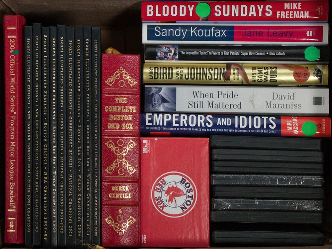 (26) COLLECTABLE SPORTS BOOKS & DVDS: Including: 2004 Red Sox vs Cardinals hardbound Official World Series Program; (9) Hardbound Ltd Ed Sports Illustrated: Patriots 2001 Champs, Patriots 2003 Champs, Celtics 2008 Champs; Red Sox 2007 Cha