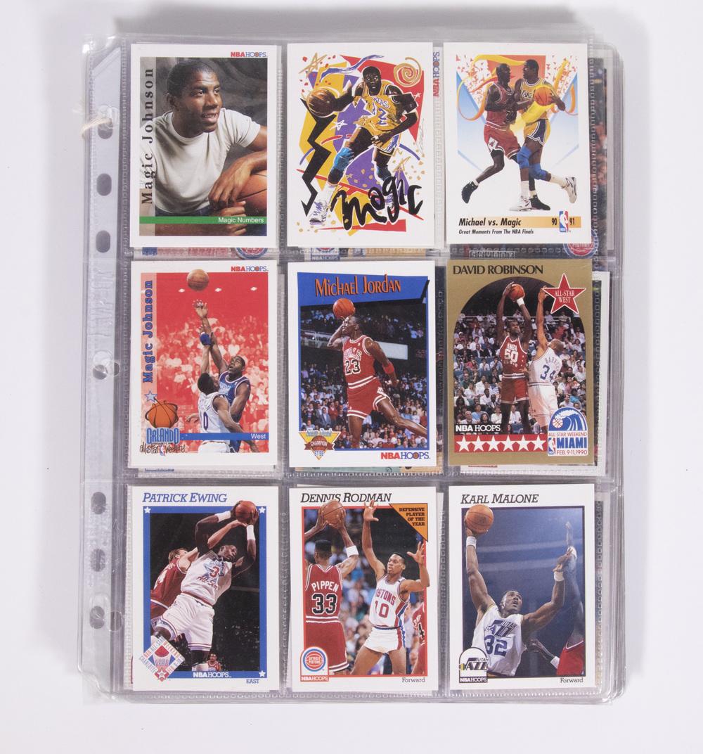 (132) 1990s NBA BASKETBALL CARDS: 132 NBA cards from 1991-1992. Various teams/players represented. Includes Magic Johnson, Michael Jordan, David Robinson, Patrick Ewing, Dennis Rodman, Scottie Pippen, Karl Malone, Isiah Thomas, James