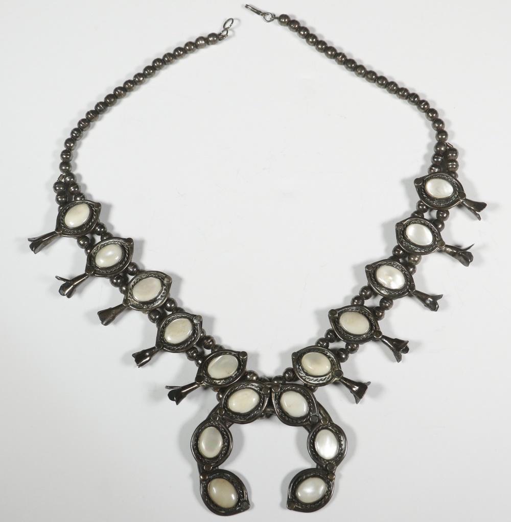 SILVER & MOTHER-OF-PEARL SQUASH BLOSSOM NECKLACE: Vintage Native American Crafted Squash Blossom Necklace, with double strand of hollow silver beads, (10) silver 'blossoms' set with oval polished mother-of-pearl, and central silver naja set with six 