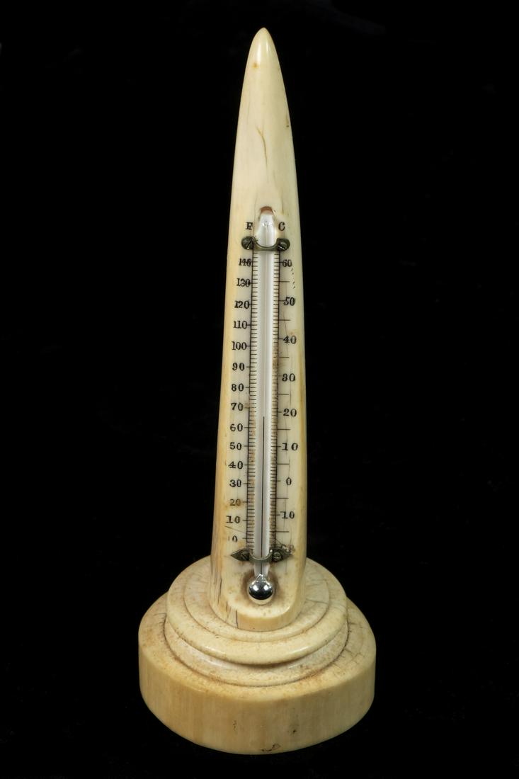 TIFFANY & CO. DESKTOP THERMOMETER MOUNTED IN A TUSK TIP: Circa 1880 Glass Mercury Thermometer set into tusk with Fahrenheit & Celsius ranges, mounted on molded disc base, stamped "Tiffany & Co., Union Square" on the underside, 8 1/4" tall, light shrinkage c