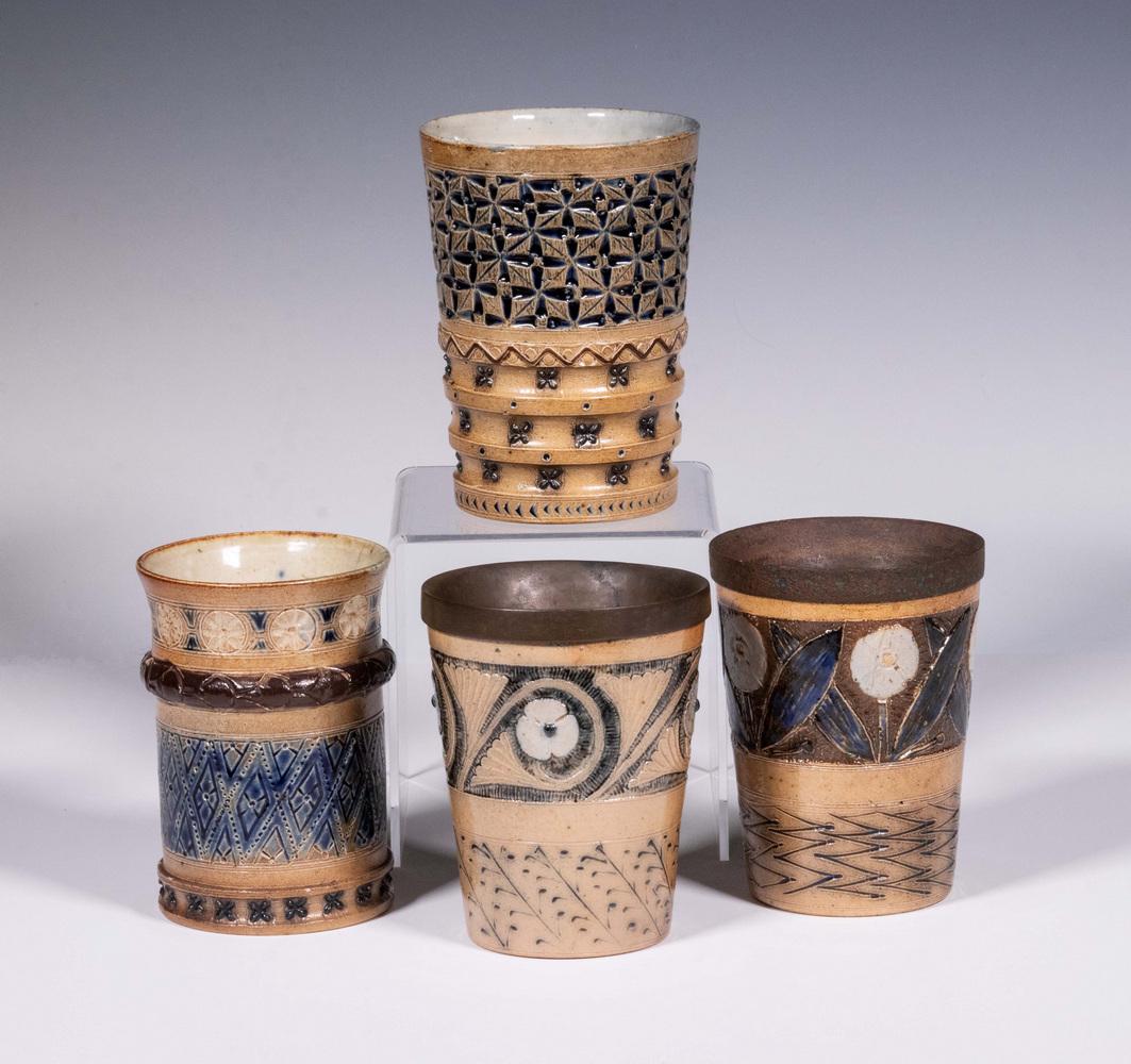 R.W. MARTIN FOR MARTIN BROTHERS STONEWARE BEAKERS: Group of (4) English Aesthetic Movement Art Pottery Cups, by Robert Wallace Martin (1843-1923), Fulham, all dated 1874, with relief molded and incised decoration, glazed in blue, brown and white on a