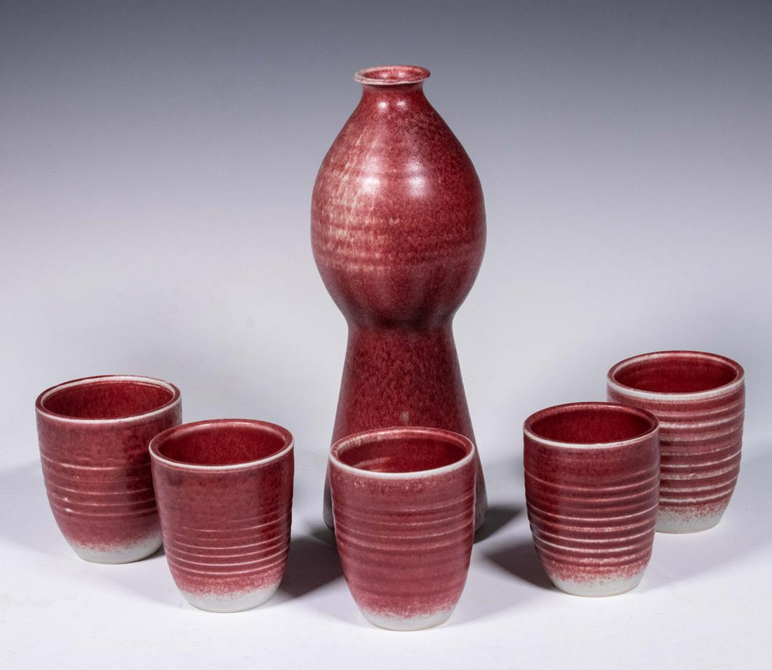 BROTHER THOMAS BEZANSON (CANADA/VT, 1929-2007) ART: (6) Pieces - Saki Decanter & (5) Cups, copper red on white glazed porcelain, incl: Decanter with egg shaped top and tapered cylindrical base, base incised "Benedictine Monks, Weston, Vermont" and with