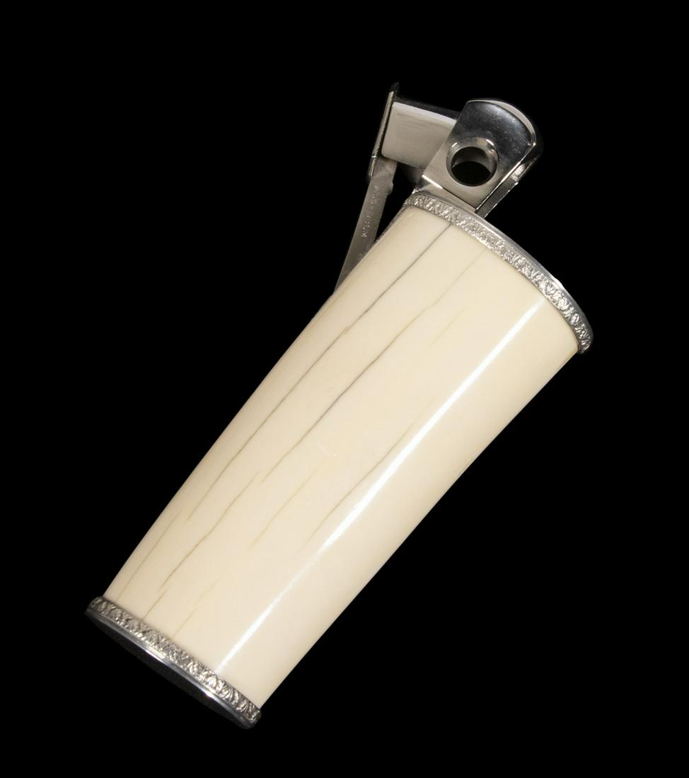 WALRUS TUSK & SOLINGEN STEEL CIGAR CUTTER: 20th c. German Cigar Cutter with a walrus tusk handle, marked on the spring shank "Pfeilring, Solingen, 5650-DBGM", unmarked metal mounts, 6 1/8" long, 3" x 1 3/8". Good condition.
