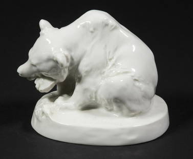 MEISSEN BEAR FIGURINE: Meissen German Blanc de Chine Porcelain Bear Figure, "Eating Bear", designed by August Gaul, blue crossed swords mark on base (with two etched lines through mark), base also marked with impressed cros