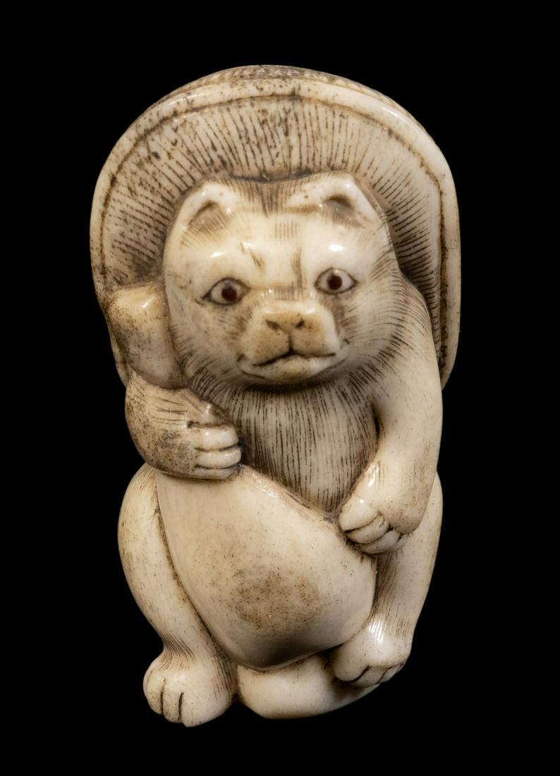19TH C. JAPANESE IVORY NETSUKE OF A CAT: Anthropomorphic Standing Cat clutching a gourd vessel to his belly and using a large mushroom as a parasol, 1 7/8" tall, wear from age and use.