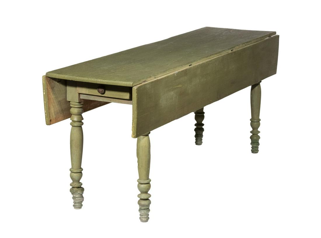 PAINTED PINE HARVEST TABLE: 19th c. American Country Green Painted Drop Leaf Table, with single end drawer with wooden pull, turned legs, 30" high, 72" long x 21" (10" leaves). Repaired break to one leg; old center top edge loss
