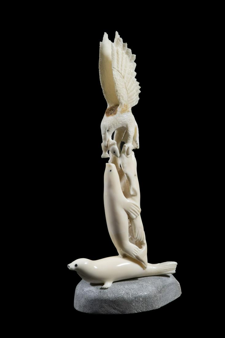 INUIT CARVED TOTEM IN WALRUS IVORY, SIGNED 'S. GUND' (1 of 3)
