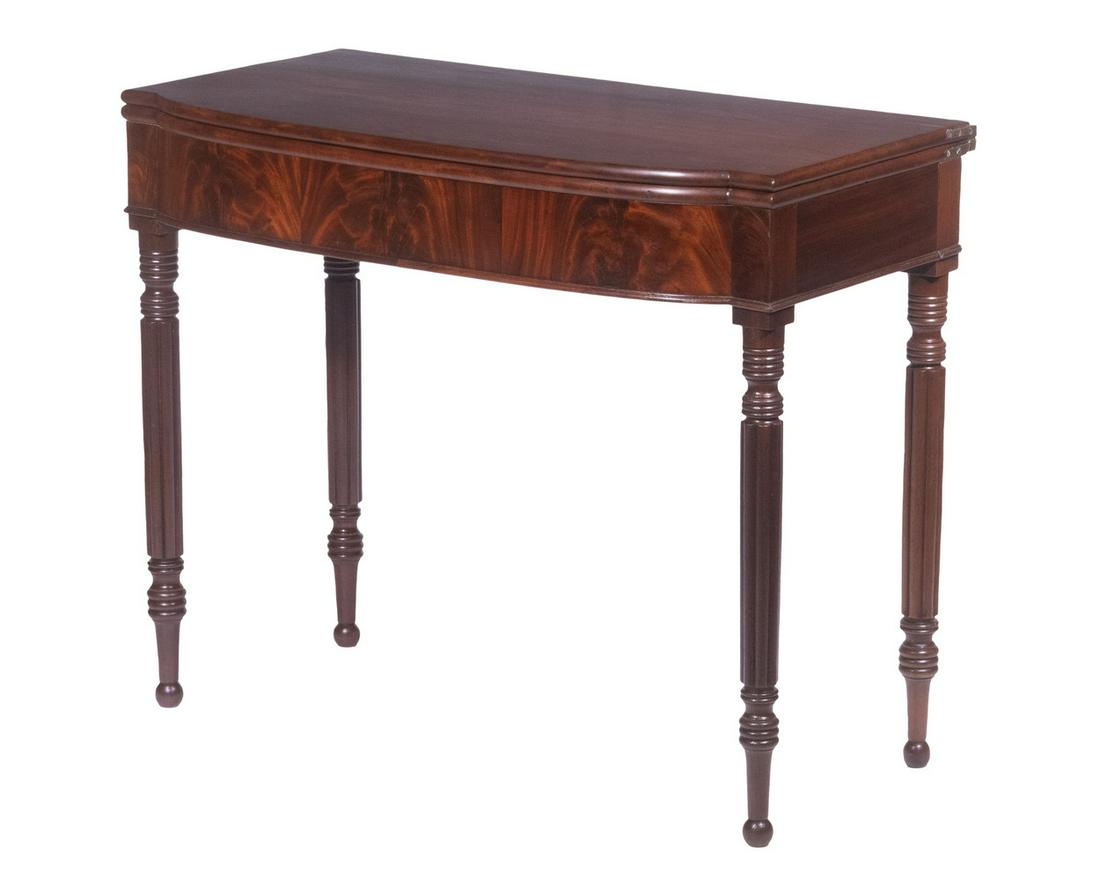 SHERATON CARD TABLE, ATTRIBUTED TO JOHN NEEDLES, BALTIMORE: Circa 1800-15 American Mahogany Card Table, attributed to John Needles, Baltimore, MD, of exceedingly dense mahogany with bookmatched highly figured inlaid bowfront frieze, set on ring turned and ribb
