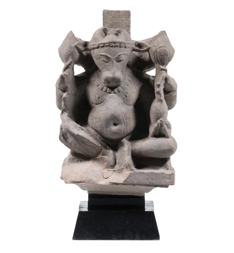 11TH-12TH C. INDIAN STONE FIGURE OF NANDI: Carved Buff Color Stone Carving of Nandi, the avatar of Shiva and his vehicle; Protector and Keeper of all Humans, having a Brahmin Bull head, seated in an architectural surround, on a black museum mo