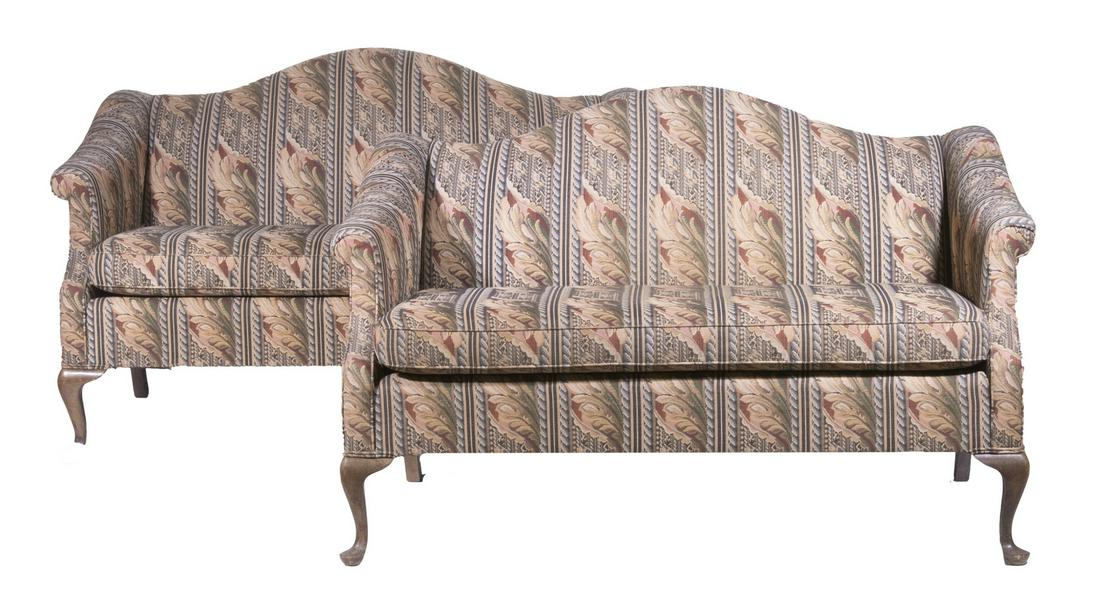 PR CAMELBACK SETTEES: Pair of Custom Queen Anne Style Loveseats, with curved backs, rolled arms, acanthus leaf pattern tapestry upholstery and self cording, removable seat cushion, set on cabriole legs and pad feet, 34 3/4