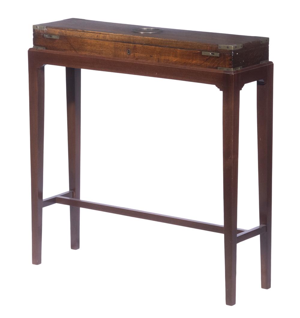 GEORGE III ERA GUN CASE ON STAND: Early 19th c. Brass Bound Oak Gun Case, with inlaid brass bullseye to lid, felt lined fitted interior with affixed label of "John Thomson, Gun Maker to His Majesty, Princes Street" (Edinburgh, 1816-27