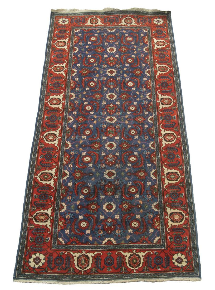 BIDJAR LONG RUG (3'10" X 8' 6"): Northwest Persia, second quarter 20th Century. Featuring an overall "Mina Khani" floral lattice in ivory, gold, red, sky and midnight blue on the royal blue field, with flame red "turtle" border. Over