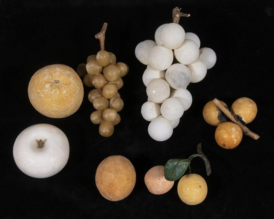 STONE FRUIT: Group of (7) Pieces of Assorted Carved Fruit, late 19th - early 20th c., including grapes, orange, apple plum and others. 2 1/4" to 7 3/4" long. Color fading, otherwise good condition.
