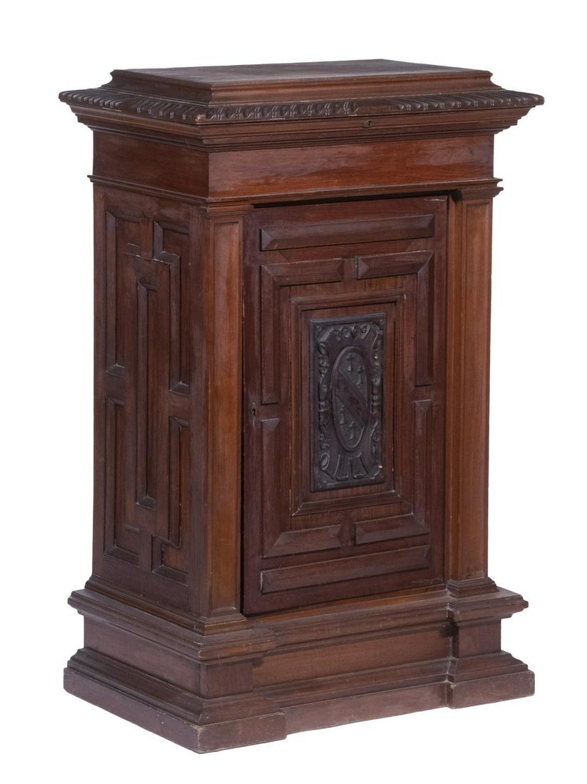 WALNUT VICTROLA CABINET: Early 20th c. Carved Storage Cabinet, that once housed a Victrola player, with beveled and carved edge hinged lift top that opens to interior storage area, case below with intricately paneled side and