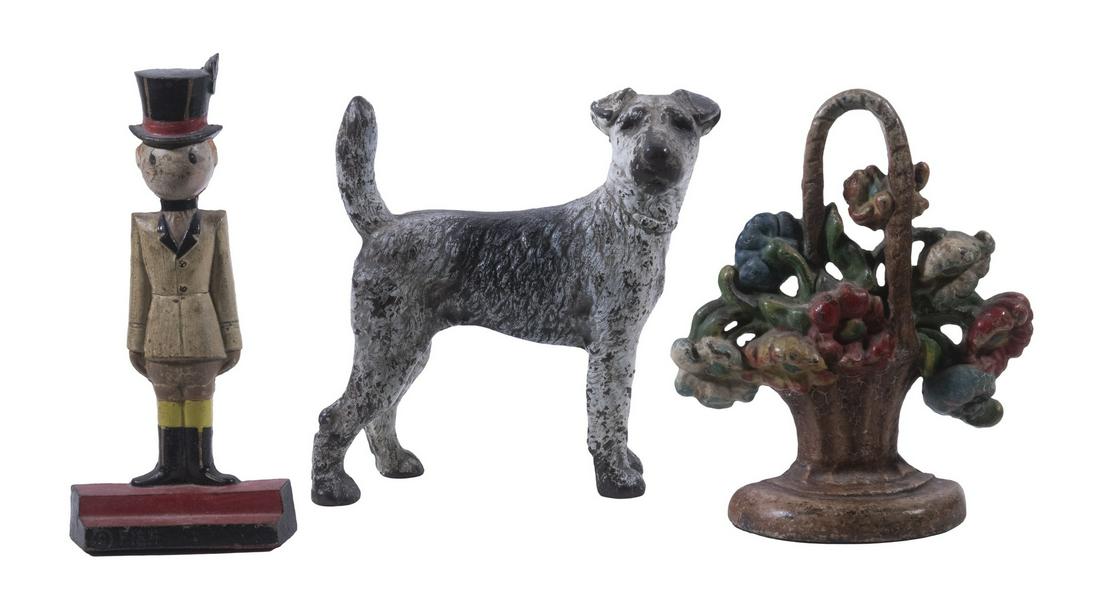 VINTAGE CAST IRON DOORSTOPS - RINGMASTER, DOG & FLOWER BASKET (1 of 3)