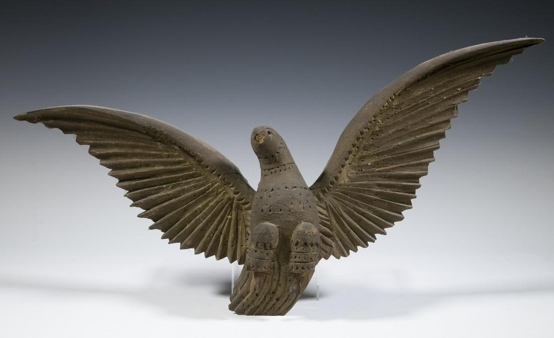 COLONIAL AMERICAN FOLK ART CARVED DOVE: Votive, spreadwing, with chipcarved and punched decoration, in grey-green paint remnants, roughly 11" x 24", loses, great patina.