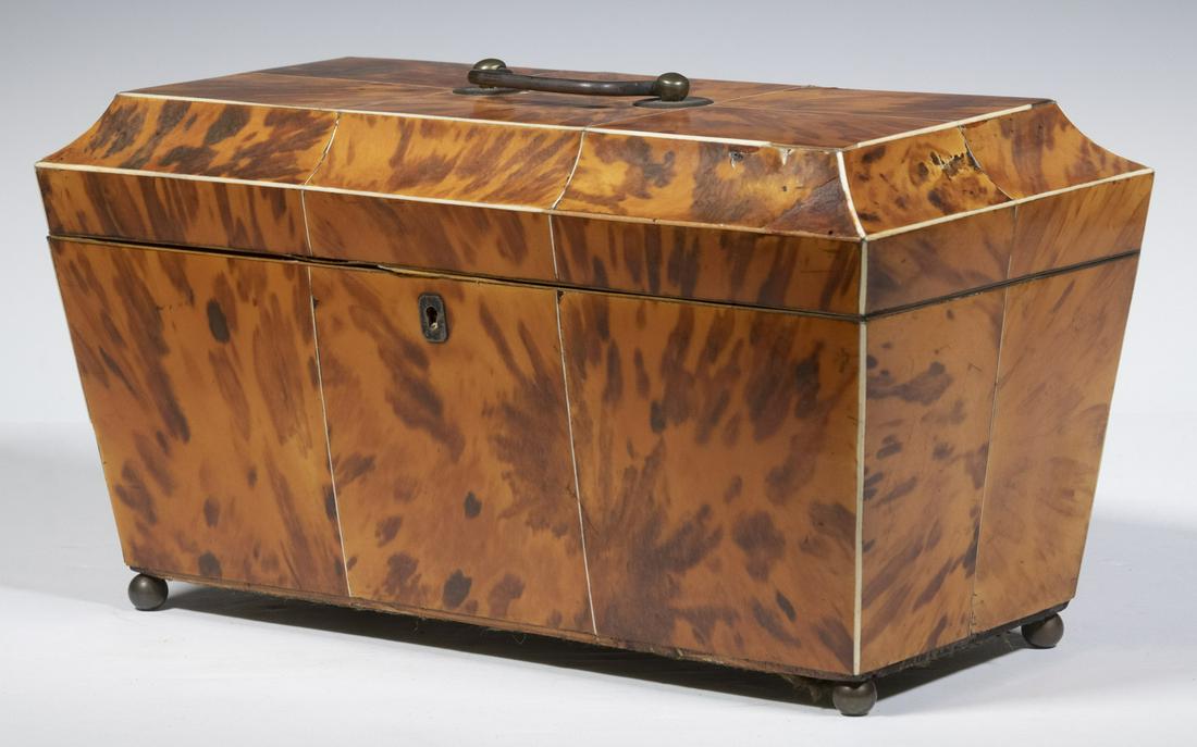 BLONDE TORTOISESHELL TEA CADDY: Large Early 19th c. English Sarcophagus Form Tea Caddy, with ivory stringing, lid handle, set on metal ball form feet, velvet lined lid, fitted interior with central mixing bowl well flanked by two re