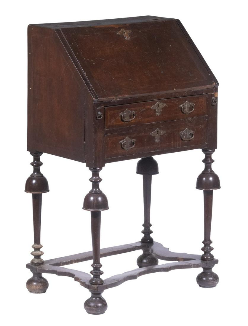 DIMINUTIVE QUEEN ANNE SLANT FRONT DESK: Mahogany Veneer with boxwood stringing, uncommon brass lock escutcheon, fitted oak valanced interior; pull out hinged desk supports, two drawers below with matching brasses, raised on ring and bell tu