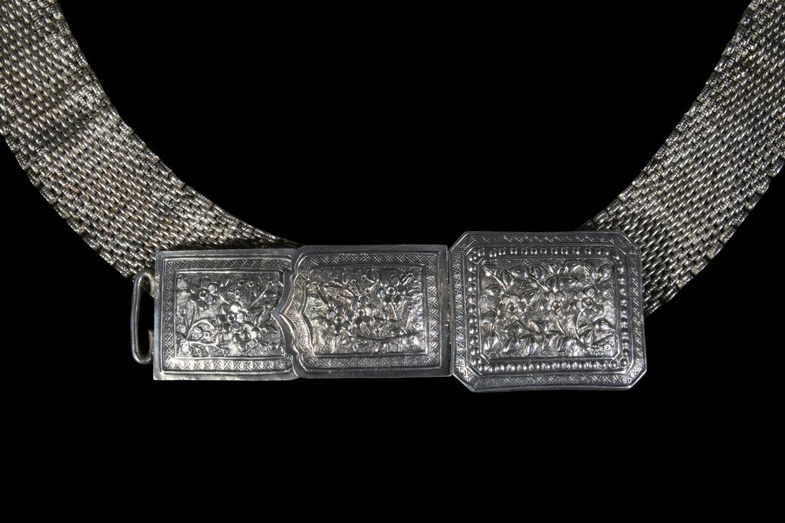 STRAITS CHINESE SILVER BELT: Ca.1900 Nonya Peranakan Silver Belt, made in Malaysia by descendants of Chinese settlers to the Malay Peninsula called Baba-Nyonga, with floral decorated buckle and mesh strap, 35 1/2" long, 1 3/4" wi