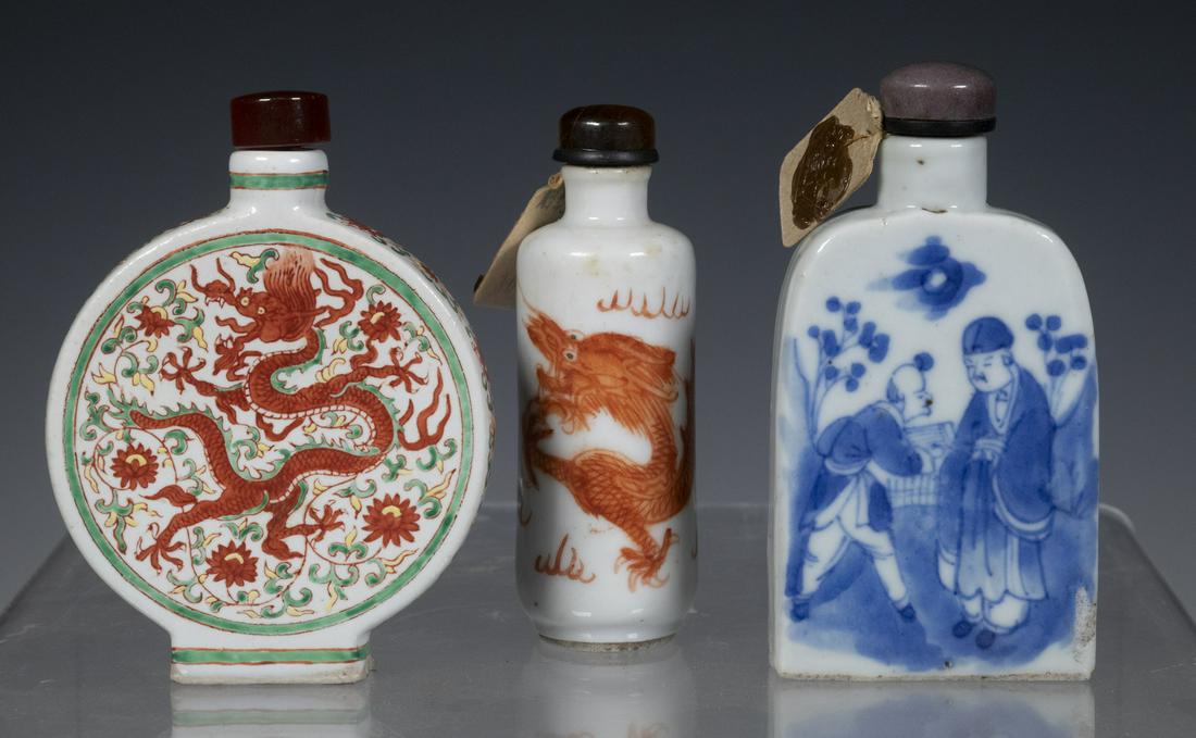 19TH C. CHINESE PORCELAIN SNUFF BOTTLES: Lot of (3) Qing Dynasty Bottles, all with spoons, incl: Moon flask shape, one side with iron red dragon among trailing lotus, other side with phoenix and lotus, iron red six character Qianlong mark on