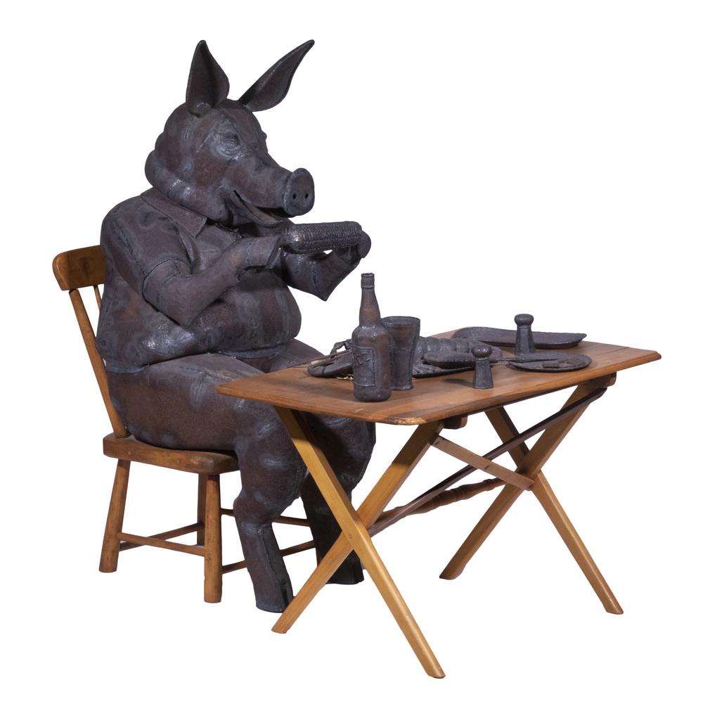 BARRY NORLING (US, 20TH C.): Lobster Dinner, welded iron sculpture with wood, signed on back "B.A. Norling" and dated '78, in two pieces, depicting a seated pig attired in a Lacoste polo shirt, holding an ear of corn and enjoying