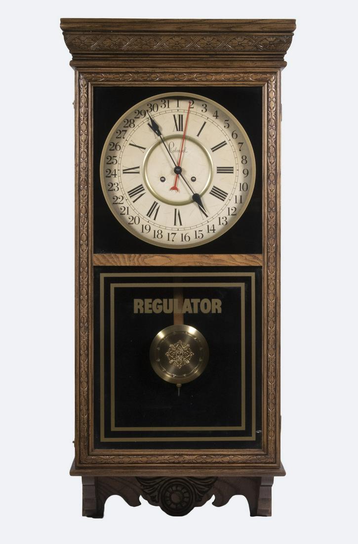 COLONIAL REGULATOR CLOCK: Vintage Oak Cased Wall Hanging Regulator Clock, by Colonial (Zeeland, MI), model 1060 311, s/n 7920282, made in 1979, with brass time and strike movement (with pendulum and key), hinged front door wit