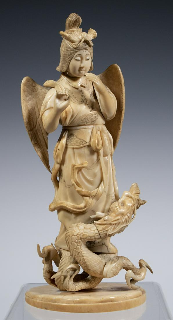 SCARCE JAPANESE IVORY OKIMONO OF A DEITY WRESTLING A DRAGON, SIGNED (1 of 5)