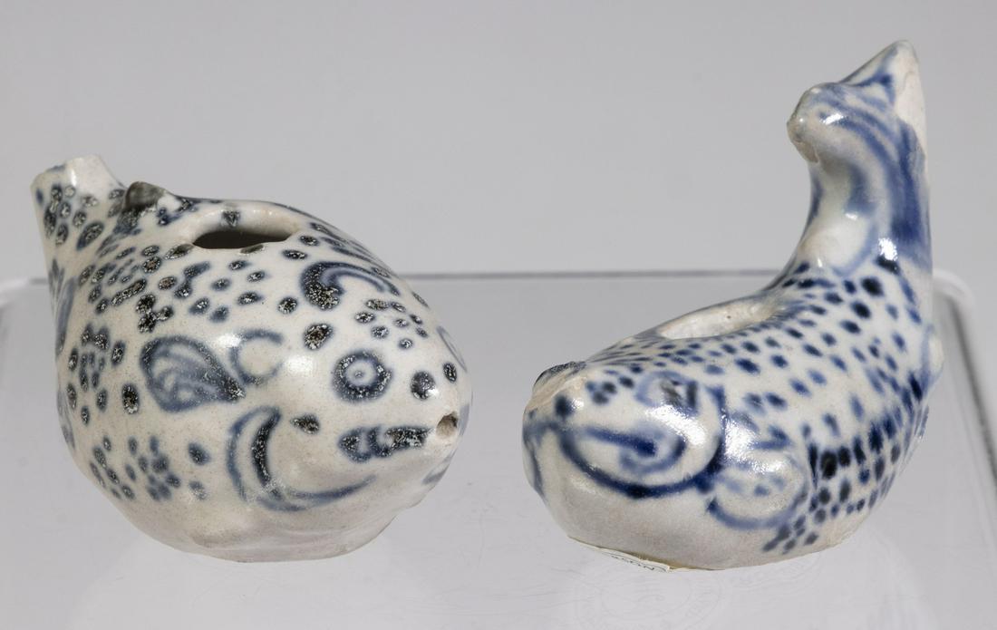 (2) 15TH C. VIETNAMESE BIRD FORM WATER DROPPERS: Both blue and white glazed, with labels from "Saga-Hoi An Hoard-Visal", nos. 10921 & 10960, the second with label from Robert McPherson of London no. HH6; 2 3/4" long. The first is missing its head. F