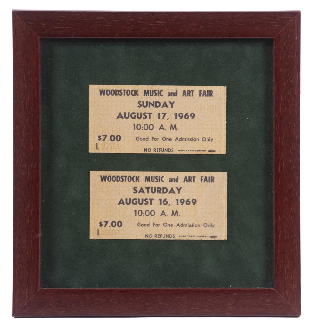 (2) TICKETS TO WOODSTOCK, FRAMED: A Pair of the Black Print $7 pre-buy tickets ($8 and reed print for day-of-sale), lacking stubs, Saturday s/n 03851 & Sunday s/n 02383. On green field, in 8 3/4" x 8 1/4" mahogany frame. Good conditio