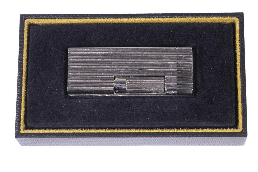 DUNHILL ROLLAGAS PALLADIUM LIGHTER IN ORIGINAL BOX: Rollagas Lines Palladium Lighter by Dunhill, Swiss made, # XK 23549, in original fitted box, with purchase invoice (from Alfred Dunhill, London in 2012), and Dunhill bag, lighter: 2 1/2" high, 1" x 1/