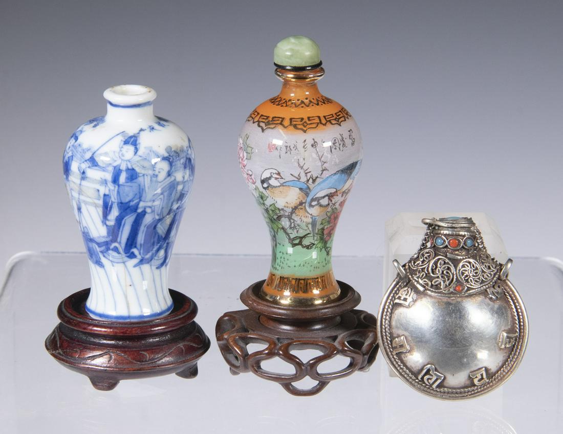 (3) SNUFF BOTTLES: Including: Chinese blue and white porcelain bottle, meiping shape, with figural decoration and Chinese character calligraphy below the neck, with carved wooden stand, in a silk covered box, bottle: 2 