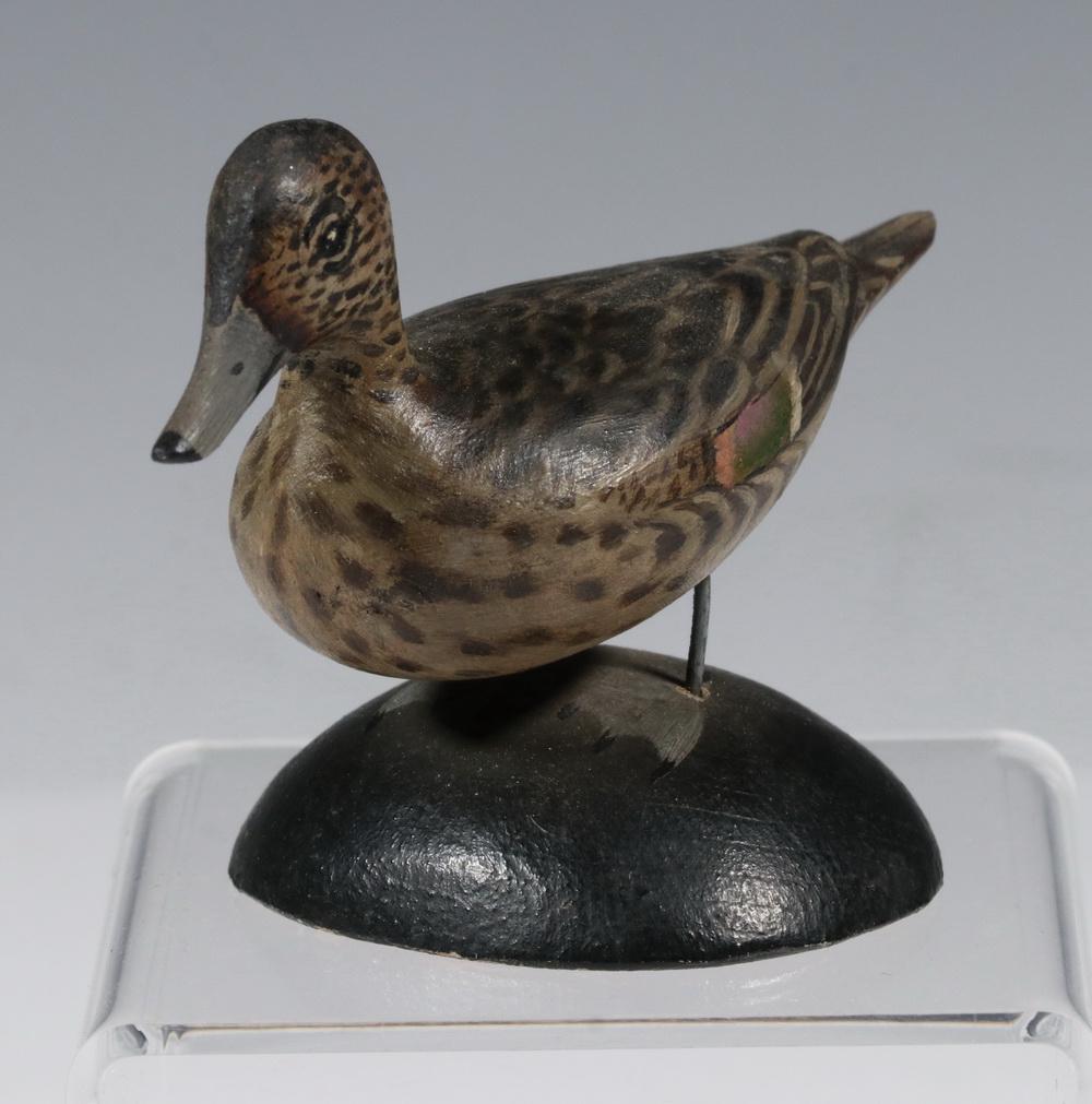 ANTHONY ELMER CROWELL (MA, 1862-1951) MINIATURE DECOY: Pintail Female Miniature Duck Decoy, by master carver Elmer Crowell of East Harwich, MA, with his stamp and label on base, 2 5/8" high, 3 5/8" x 2 1/8". Neck repair, tail touch-up.