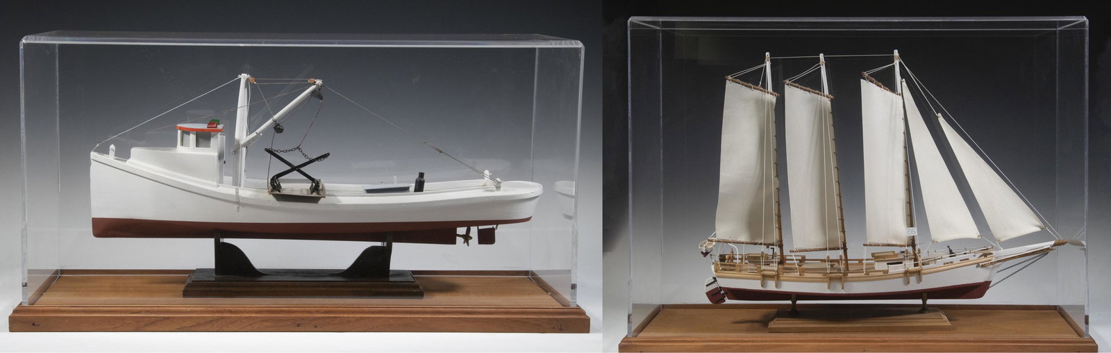 CASED SHIP MODELS: (2) Contemporary Wooden Models, from kits, in Acrylic display cases, incl: Three mast schooner, fully rigged, with lifeboat, ship's wheel and anchor, marked "95", 21" high, 30" x 11"; and Fishing traw