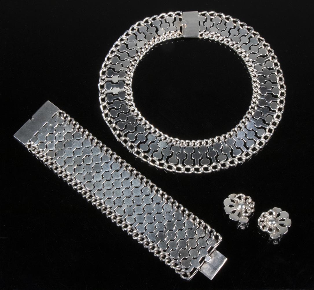 TAXCO STERLING JEWELRY SUITE: (3) Piece Mexican Silver Jewelry Lot, incl: Choker necklace, 1" wide, 13 1/2" long; Bracelet, 1 1/2" wide, 7 1/4" long; and Pair of ear clips, 1" x 1"; 6.0 ozt. Good condition.