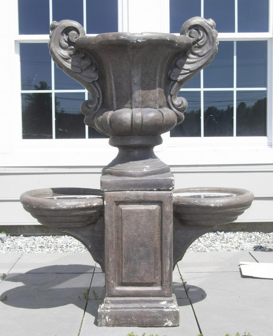LARGE TWO-PART CAST STONE URN FORM GARDEN FOUNTAIN IN BROWN PAINT: Neo-Classical Form with two small catch basins flanking the center urn, 48" tall , 36" x 16".
