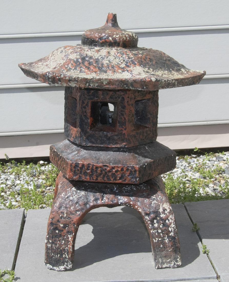 SMALL CAST STONE JAPANESE PAGODA FORM GARDEN LANTERN: In remnants of red paint, 24" x 14" x 14".