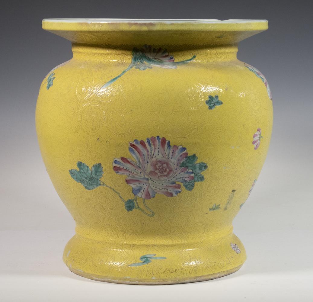CHINESE FAMILLE ROSE PEDESTAL: 19th c. Porcelain Pedestal Seat, with floral and sgraffito decoration on a yellow ground, 13 1/2" high, 12" diam. Rim chip.