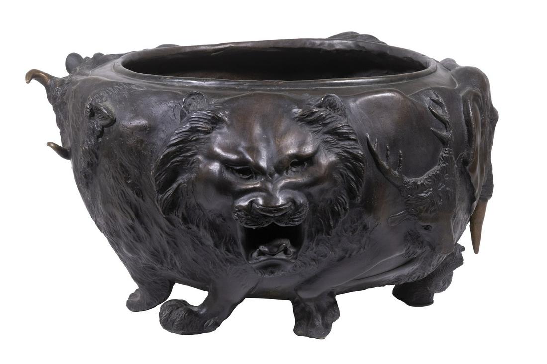 SEIYA GENRYUSAI (JAPAN, 1868-1912) BRONZE JARDINIERE: Large Meiji Period Japanese Bronze Vessel, 19th c., with a variety of animal heads and legs cast in relief, impressed artist's seal mark on base, 9 1/2" high, 18" diam. Surface wear.