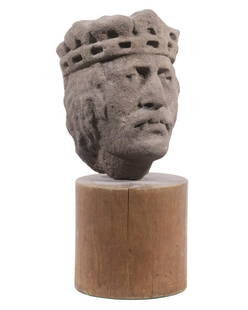 GOTHIC PERIOD SANDSTONE KING'S HEAD: Handsome Man with long hair and moustache, in reticulate crown, probably French, from the exterior embellishment of a Cathedral, ca 14th c. with flat back retaining rough chisel marks. Mounted on a cy