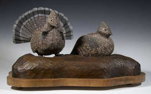 BIRD SCULPTURE BY STEVE HITCHCOCK: Two Ruffled Grouse, carved and painted wood, signed "Steve Hitchcock, 1991" at back base edge, highly detailed with glass eyes and intricately carved feathers, mounted on a wooden base, 13 1/4" high,