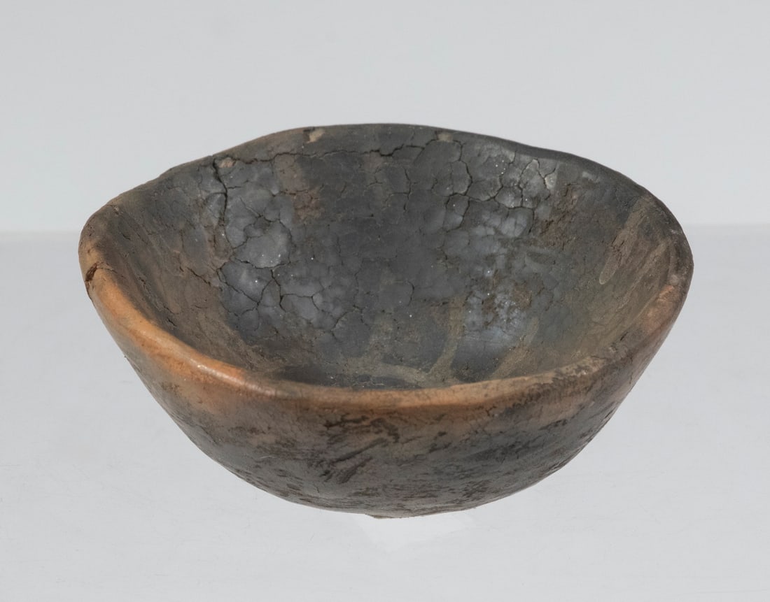 NATIVE AMERICAN POTTERY: Prehistoric Miniature Clay Bowl with sun decoration, 2 3/8" diam. Found in New Mexico.