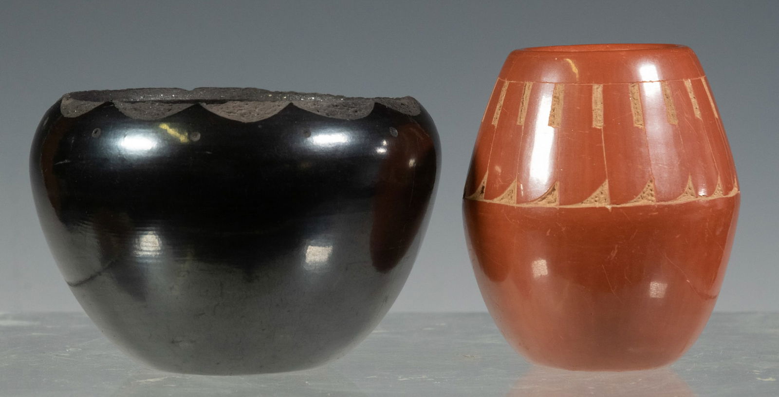 JUAN TAFOYA (NM, 1949-2006) POTTERY: (2) Pieces of Finely Crafted Native American Pottery, both signed Juan Tafoya, San Ildefonso Pueblo and dated 2003, incl: Carved blackware low pot, 2 1/2" high; and Small vase with carved feather desi