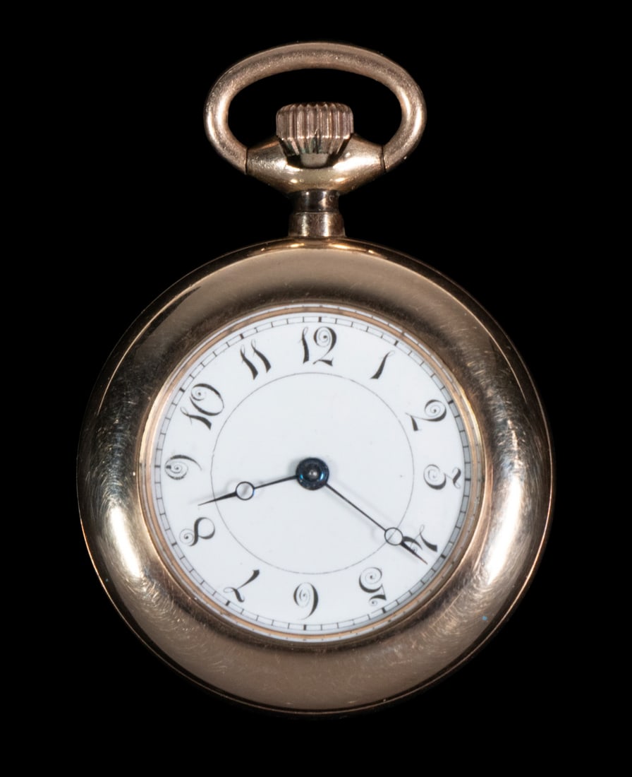 NEW ENGLAND WATCH CO. PENDANT WATCH: Early 20th c. Gold Filled Open Face Watch, sn 78391, with white enamel dial and Arabic numerals, with green enameled engine turned back. Stored in a safety deposit box for many years.