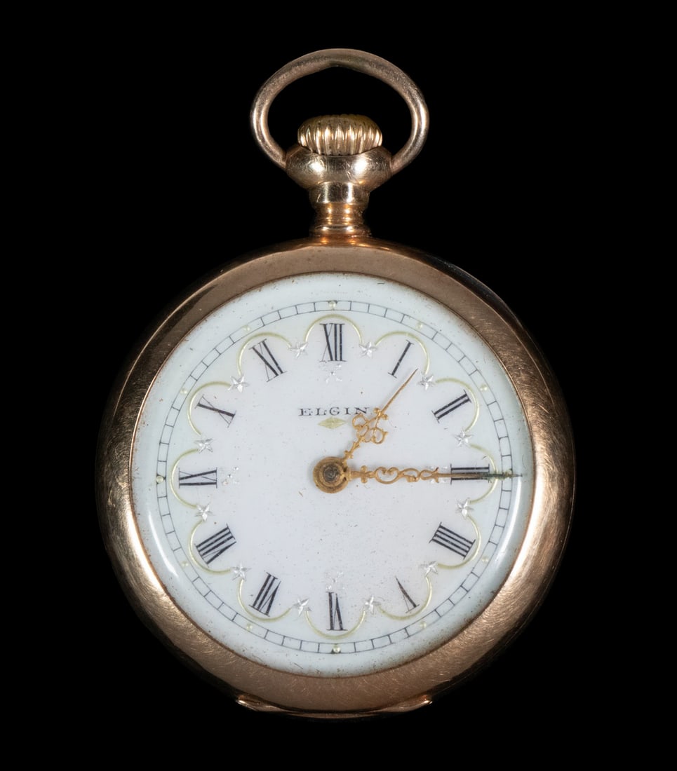 ELGIN 14K GOLD PENDANT WATCH: 14K Gold Open Face 0-Size Watch by Elgin, sn 10386098, 7-jewels, with white enamel dial and black Roman numerals with gilded embellishments, Dubois case with engraved EMC monogram. Stored in a safety 
