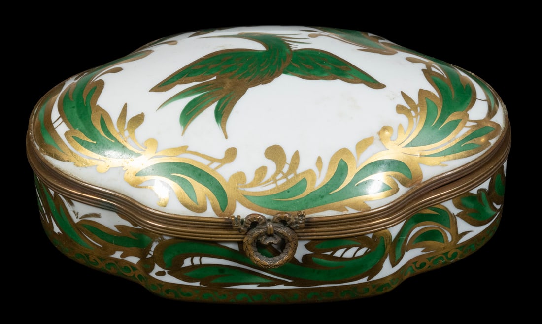 FRENCH PORCELAIN TRINKET BOX: Oval Dresser Box, with hand painted bird and swirl decoration, gold hand painted mark on base, 2 1/2" high, 5 3/4" x 3 1/2". Old hinge repair.