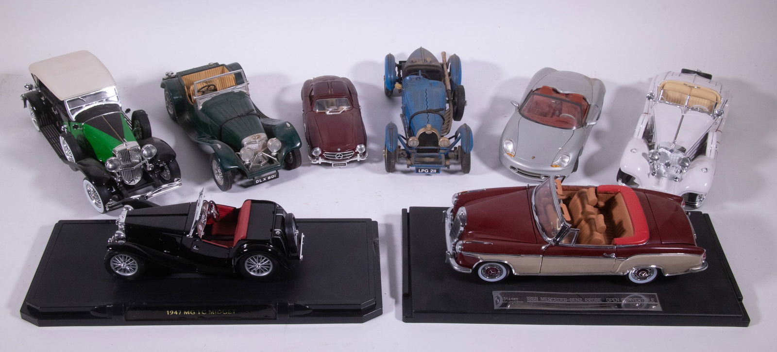 REPLICA AUTOMOBILE MODELS: Lot of (8) models, most 1:18 scale, incl: Maisto Mercedes Benz 500K Special Roadster (1936); Greenlight Duesenberg II SJ; Burago Jaguar SS 100 (1937); Staur 1958 Mercedes-Benz 220SE open convertible,