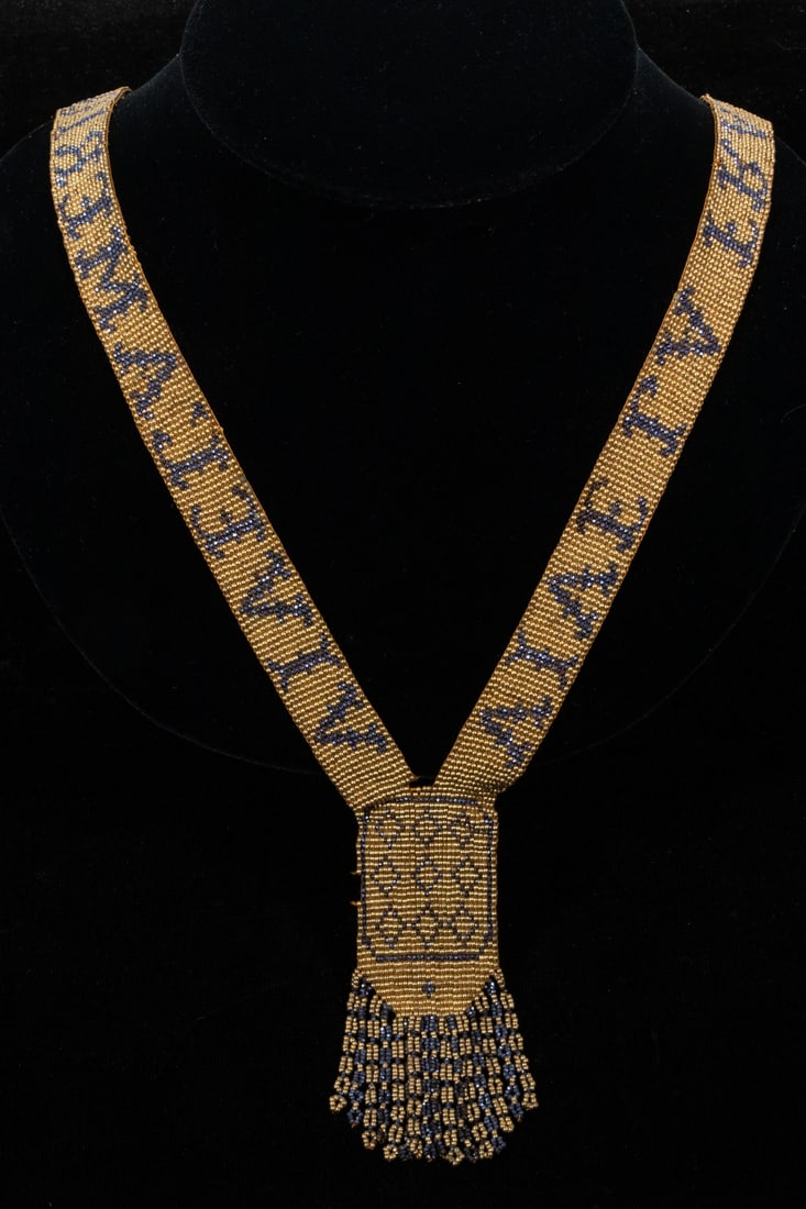 1920S ERA WOVEN SEED BEAD NECKLACE: Gold and Blue Loom Woven Necklace, with drop fringe center, with the words "Vive La France" and "Vive L'Amerique" on each side, possibly a post WWI souvenir brought by a soldier returning to the US, 3